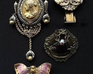 Antique and Vintage brooches, including a Victorian-style Cameo.