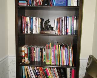 Tall bookcase, with guess what..............books on it!