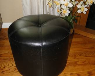 Round black ottoman