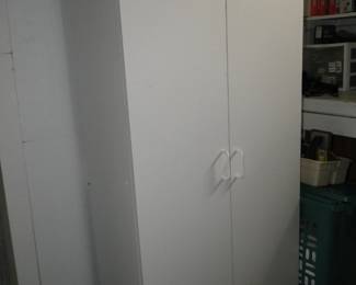 Tall white storage cabinet