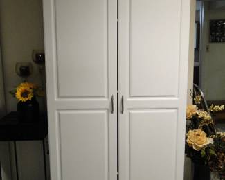 Another set of storage cabinets, surrounded by faux flowers.  Make the most of life, be kind