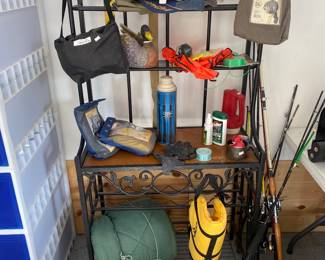 Assorted fishing gear including some tackle. rods and reels
