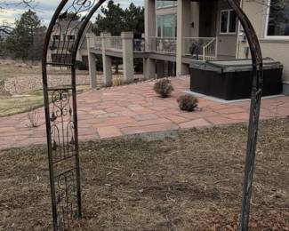 Wrought Iron Garden Arbor with Scrollwork and Leaf Motifs
