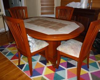 Unusual tile-top table & 4 chairs, colorful rug