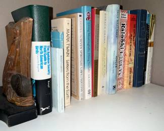 Assorted Books and Wooden Bookend