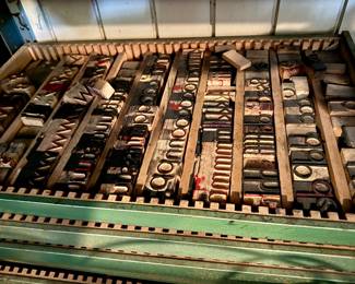 Original type in storage drawers from San Antonio Printing Company owned by the Clegg family.