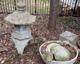 Concrete pagoda and many other interesting yard sculptures and decor.