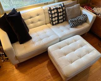 Mid-century-style couch and ottoman.