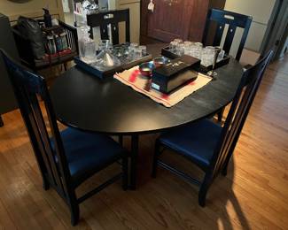 Danish Modern dining table (made in Denmark) with four chairs made in Italy by AI (Atelier International Limited).