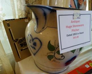 a Ver Lg. Ironstone Pitcuer with date of 1853 in hart
