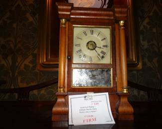 a Small Antique mantle clock (runs like a haouse afire !)