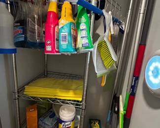 Cleaning supplies and metal storage shelf