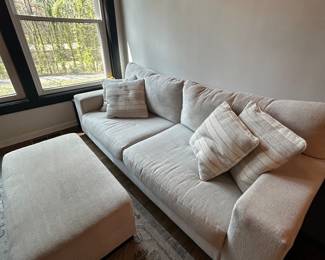 Cream sofa and ottoman 