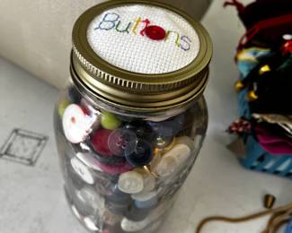 #40	Quart Jar w/mixed colored buttons w/hand embroiered top	 $20.00 			