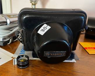 #128	Yashica 35MM Camera w/Cover	 $30.00 			