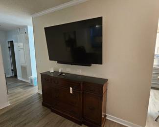 credenza, 65" TV,  sound bar and sub woofer