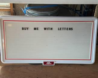 Dr pepper sign board with letters, numbers, and Dr. Pepper Brand images