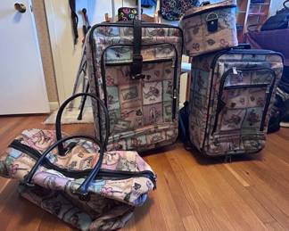 Assorted luggage including a set of Winnie the pooh luggage