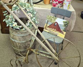 Primitive wood barrel and garden plow