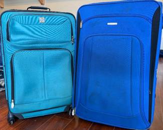 Roller suitcases with smaller suitcases nested inside