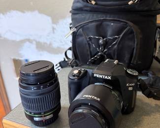 Pentax DSLR camera complete with batteries, chargers, lenses, cables, bag and more