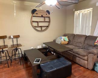 Couch with recliners. Soft leather. Swivel bar stools. Coffee table raises to make it easier to eat off of. 