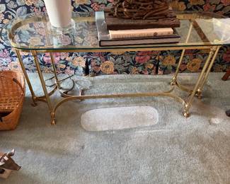 #2 - $150 - oval beveled glass console table on brass legs 4'x16"x24"T