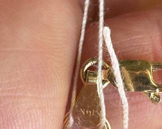 #6- 10kt gold charm bracelet with 10 charms 6" - weight - 