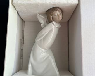 Lladro Curious Angel figurine.