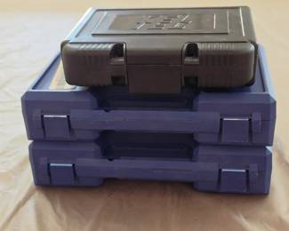 2 Smith & Wesson Factory Blue Hard Cases and a black one