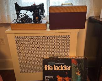 Vintage singer sewing machine and escape ladder 