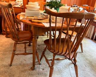 Maple dinette set with round drop-leaf table and Windsor chairs