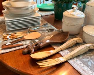 Hand carved wooden salad servers with ironstone dinnerware and canisters