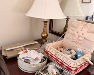 Pair of brass lamps sewing basket and button tin lot