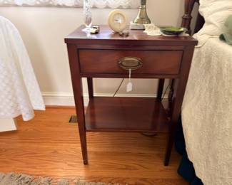 Mahogany nightstand with drawer and vintage clock