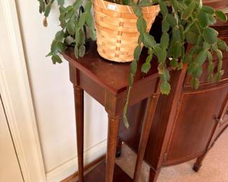 Christmas cactus on tall mahogany plant stand