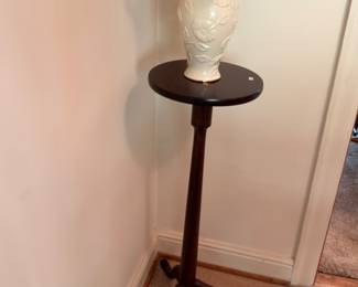Mahogany tripod candlestand with white ceramic urn vase