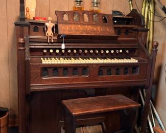 Antique pump organ with matching wooden bench stool