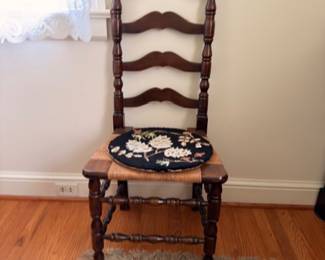 Antique ladderback chair with needlepoint rush seat cushion
