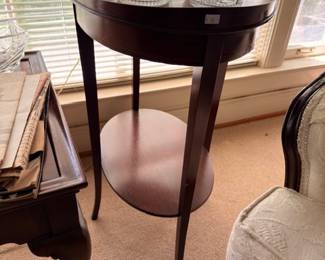 Round mahogany side table with crystal accessories
