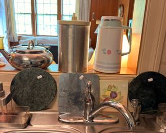 Silver teapot stainless thermoses marble cheese boards and kitchen items