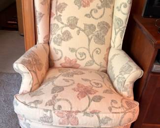 Queen Anne wingback armchair with cream floral scroll upholstery