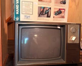 Vintage portable television set on marble stand