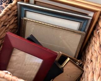 Basket of assorted picture frames