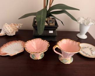 Pink lusterware shell dishes with milk glass vase and conch shell