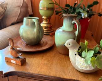 Green drip glaze pottery pitchers and vase with carved wooden ducks