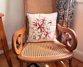 Antique carved walnut cane seat and back rocking chair