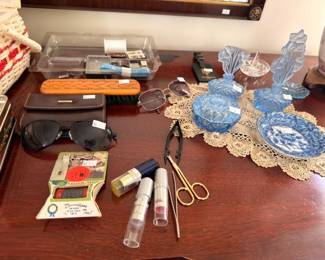 Dresser top lot blue glass perfume bottles sunglasses and vanity items