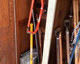 Long handled tools sledgehammer rakes and posthole digger