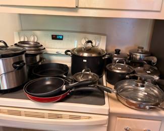 Large lot of stainless steel cookware pots and pans with stockpots